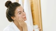 Applying coconut oil on skin